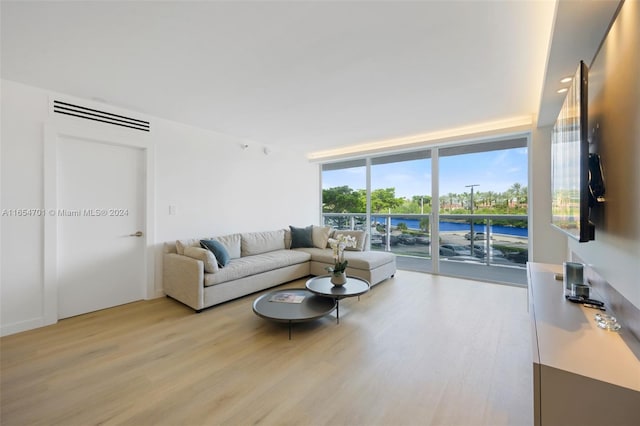 20505 E Country Club Dr Unit 231, Aventura, FL 33180 - living area featuring light wood finished floors and floor to ceiling windows