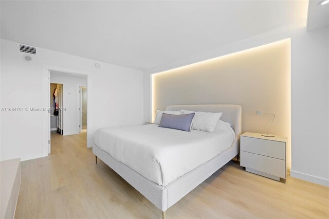 bedroom with light wood-type flooring