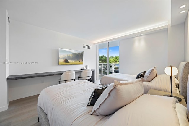20505 E Country Club Dr Unit 231, Aventura, FL 33180 - bedroom featuring wood finished floors, visible vents, baseboards, recessed lighting, and access to exterior