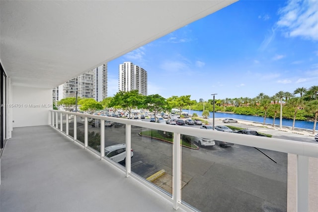 balcony featuring a water view