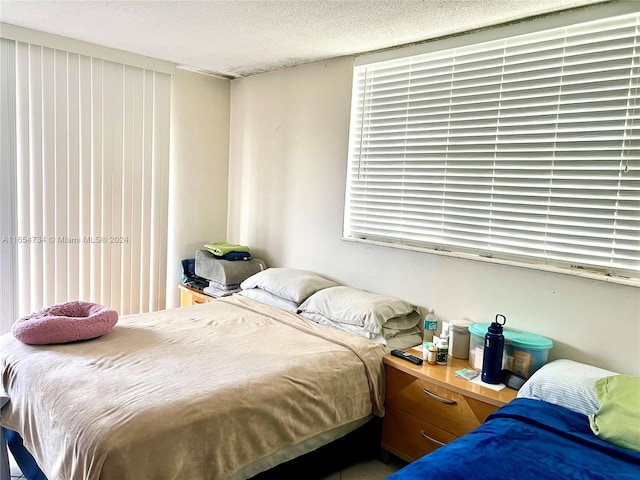 bedroom featuring a textured ceiling