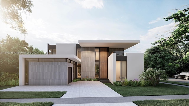 contemporary home featuring a garage and a front yard