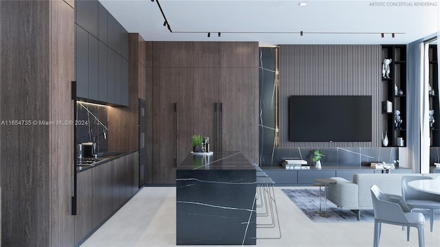 kitchen with dark brown cabinets, a kitchen island, and decorative backsplash