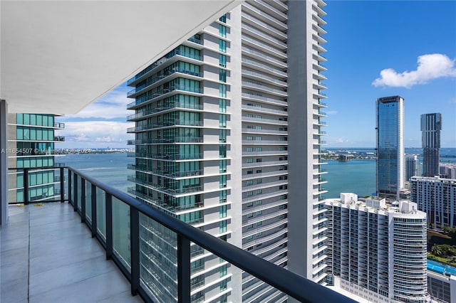 balcony featuring a water view