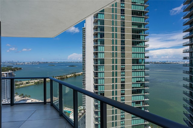 balcony featuring a water view