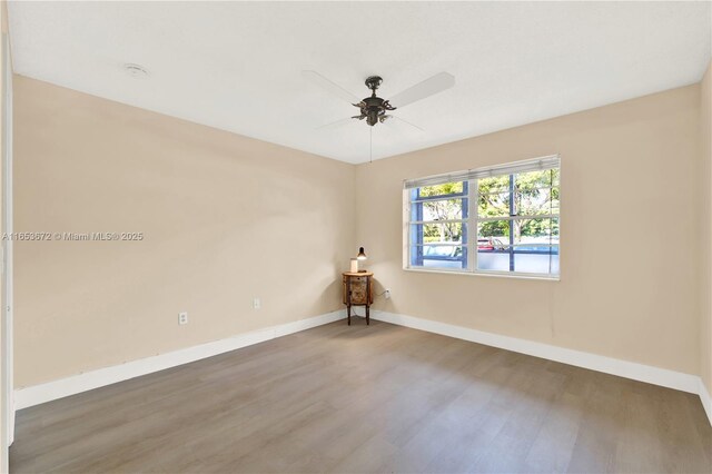 1516 S Lakeside Dr Unit 112, Lake Worth, FL 33460 - empty room featuring wood finished floors and ceiling fan