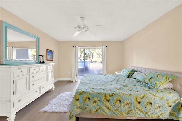 1516 S Lakeside Dr Unit 112, Lake Worth, FL 33460 - bedroom with wood finished floors, access to outside, and a ceiling fan