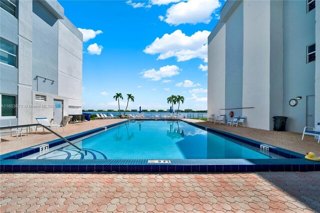 view of swimming pool with a patio