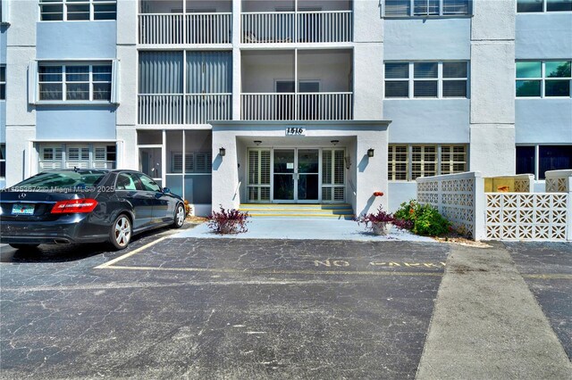 1516 S Lakeside Dr Unit 112, Lake Worth, FL 33460 - view of property featuring uncovered parking