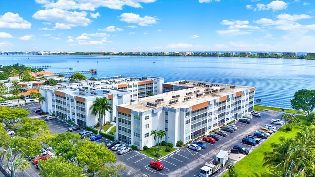 1516 S Lakeside Dr Unit 112, Lake Worth, FL 33460 - drone / aerial view of apartment complex / building and a nearby body of water