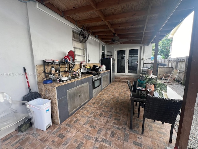 view of patio / terrace with ceiling fan, sink, and area for grilling