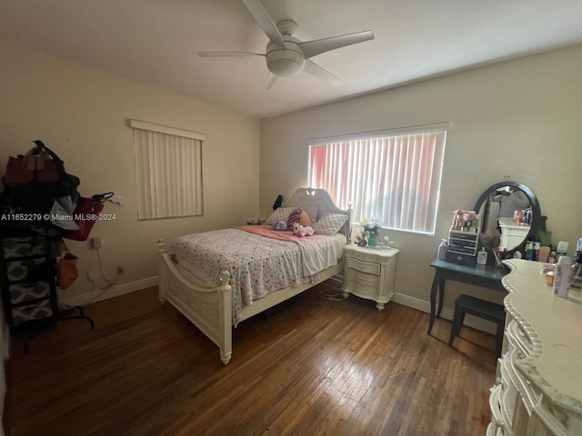 bedroom with ceiling fan and dark hardwood / wood-style floors