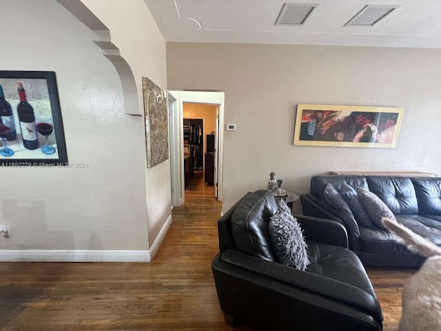 living room featuring dark wood-type flooring