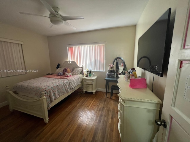 bedroom with ceiling fan and dark hardwood / wood-style floors