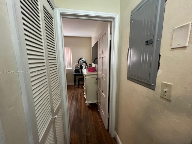 corridor featuring electric panel and dark hardwood / wood-style floors