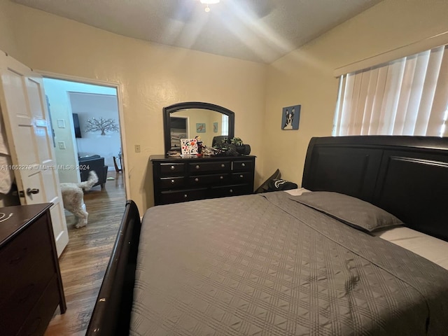 bedroom featuring wood-type flooring and ceiling fan