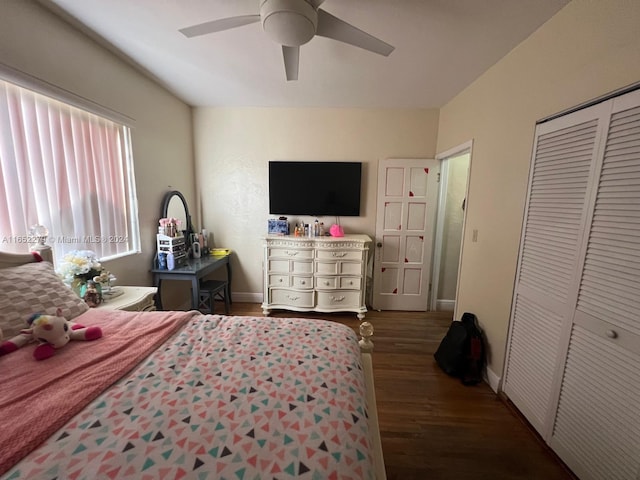 bedroom with ceiling fan, dark hardwood / wood-style floors, and a closet