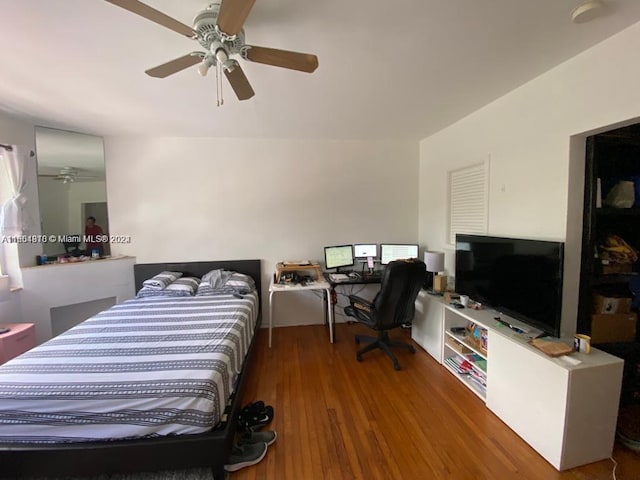 bedroom with ceiling fan and hardwood / wood-style floors