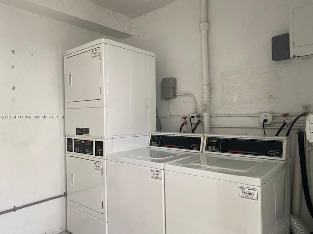 laundry area with washing machine and dryer and stacked washer and dryer