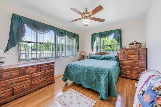 bedroom featuring ceiling fan and light hardwood / wood-style flooring