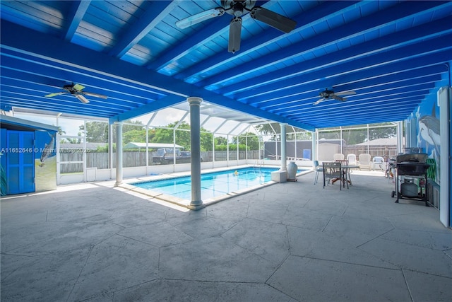 view of pool with grilling area, a lanai, a patio area, and ceiling fan