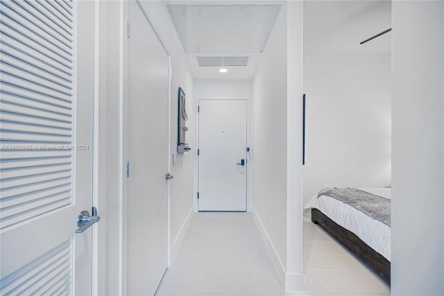 corridor with light tile patterned floors