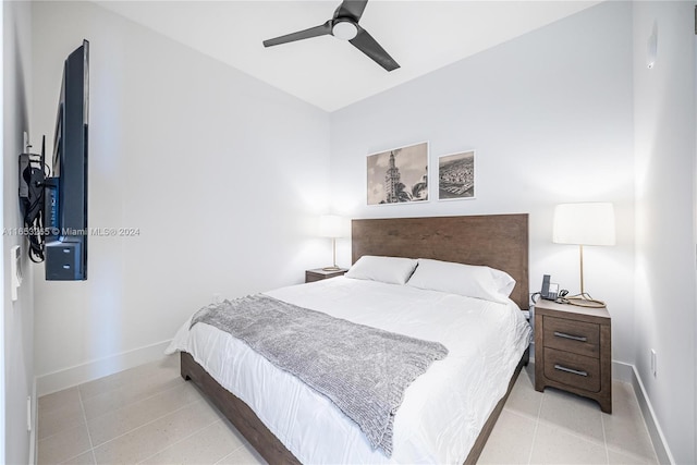 tiled bedroom with ceiling fan