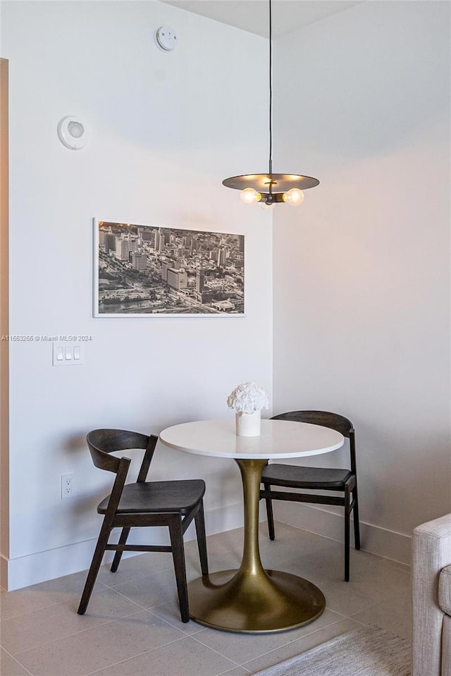 dining area with light tile patterned floors