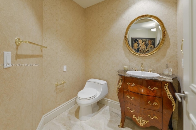 bathroom featuring vanity and toilet