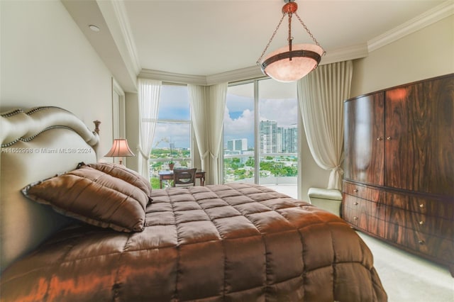 bedroom with crown molding and carpet floors