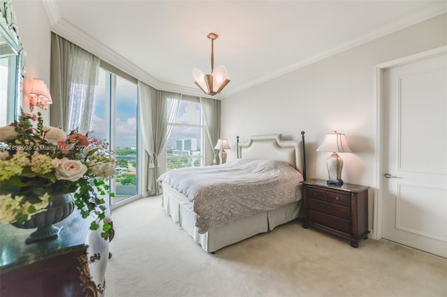 carpeted bedroom with access to exterior, ornamental molding, and a chandelier