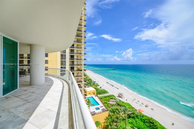 balcony with a view of the beach and a water view