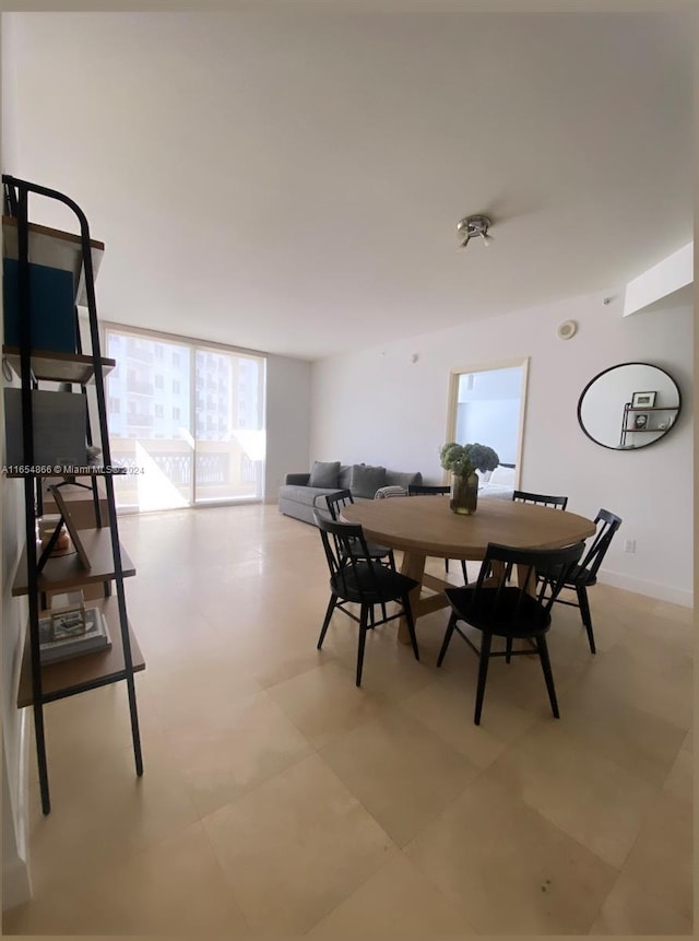 dining area featuring expansive windows