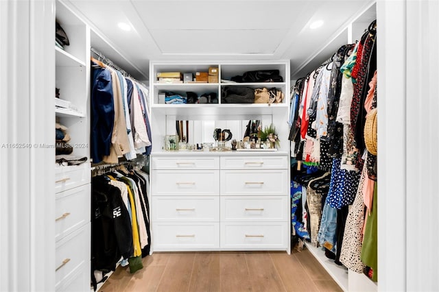 spacious closet with light hardwood / wood-style floors