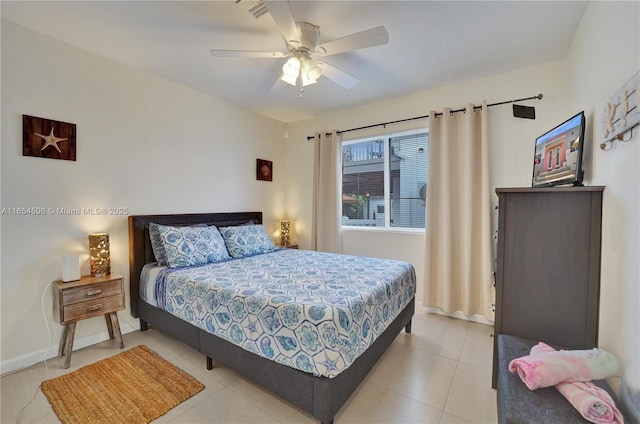 tiled bedroom with ceiling fan