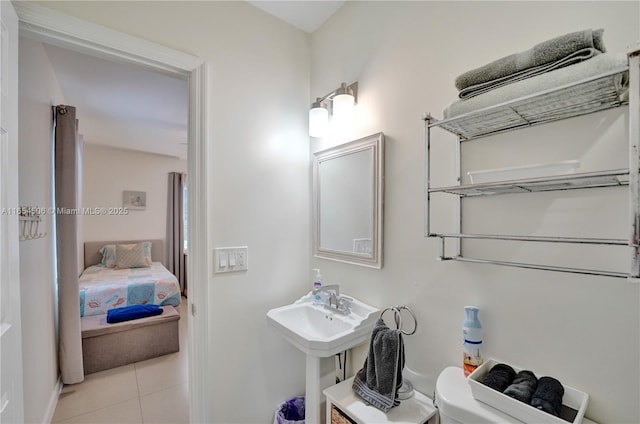 bathroom with tile patterned floors and toilet