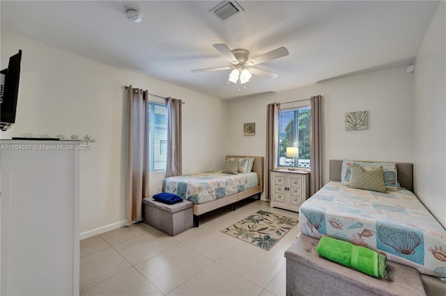 bedroom with light tile patterned floors and ceiling fan