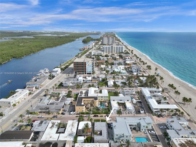 bird's eye view featuring a water view and a view of the beach