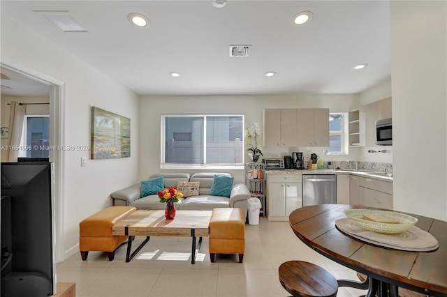 kitchen featuring light tile patterned floors and appliances with stainless steel finishes