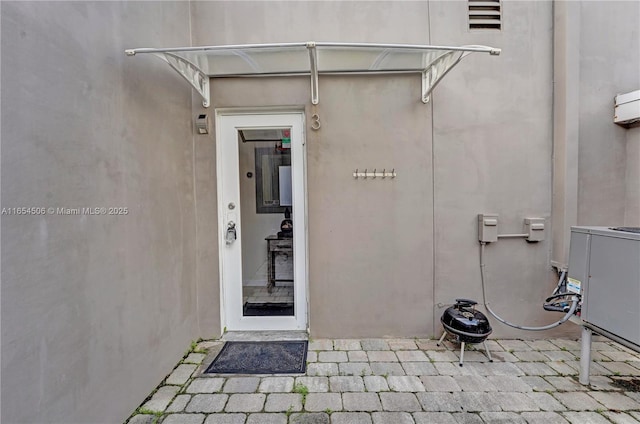 doorway to property with central air condition unit