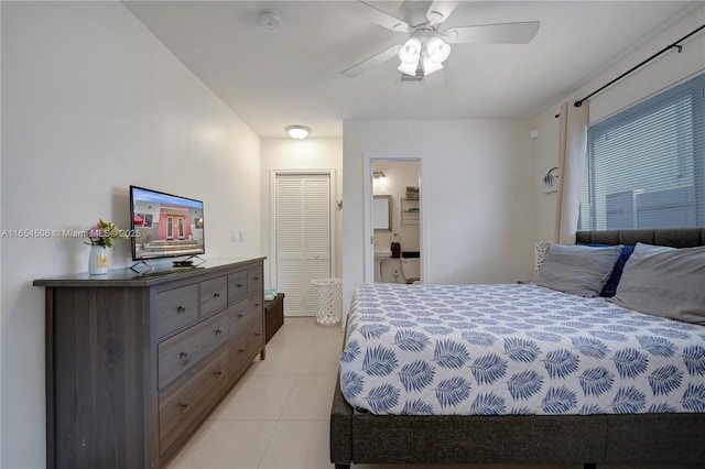 bedroom with light tile patterned floors, a closet, and ceiling fan