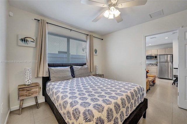 bedroom featuring light tile patterned flooring, ceiling fan, and stainless steel fridge