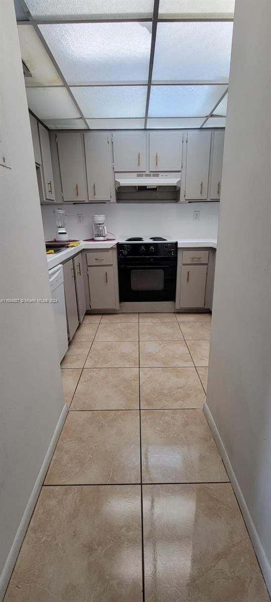 kitchen with white dishwasher, black range with electric cooktop, light tile patterned flooring, and gray cabinetry