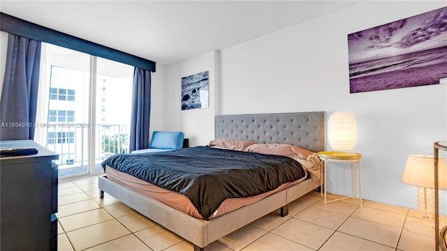 tiled bedroom featuring access to outside