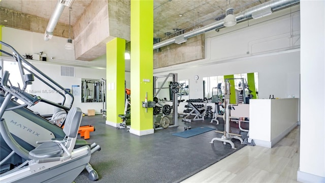 gym featuring a high ceiling