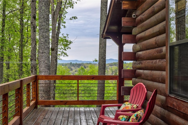 wooden terrace featuring a mountain view