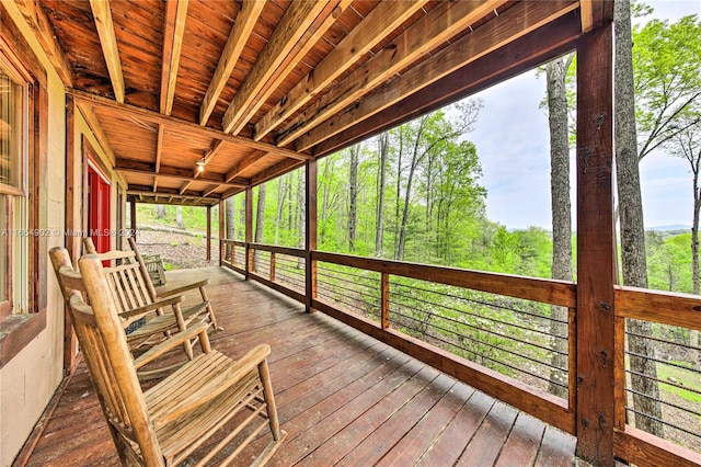 unfurnished sunroom featuring wood ceiling