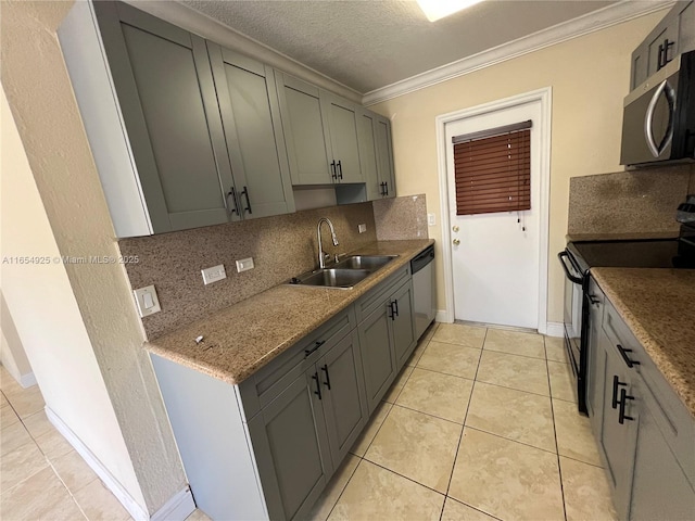 kitchen with backsplash, sink, light tile patterned floors, ornamental molding, and appliances with stainless steel finishes