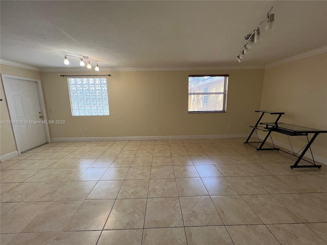 unfurnished room featuring light tile patterned floors and ornamental molding