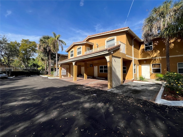 view of front of house with a balcony